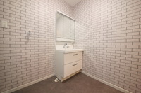 ＡＦＴＥＲ：壁がタイルで床がコンクリート調と無機質な感じにしたかった洗面室。